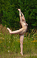 Nude ballerina is standing in different positions showing naked body